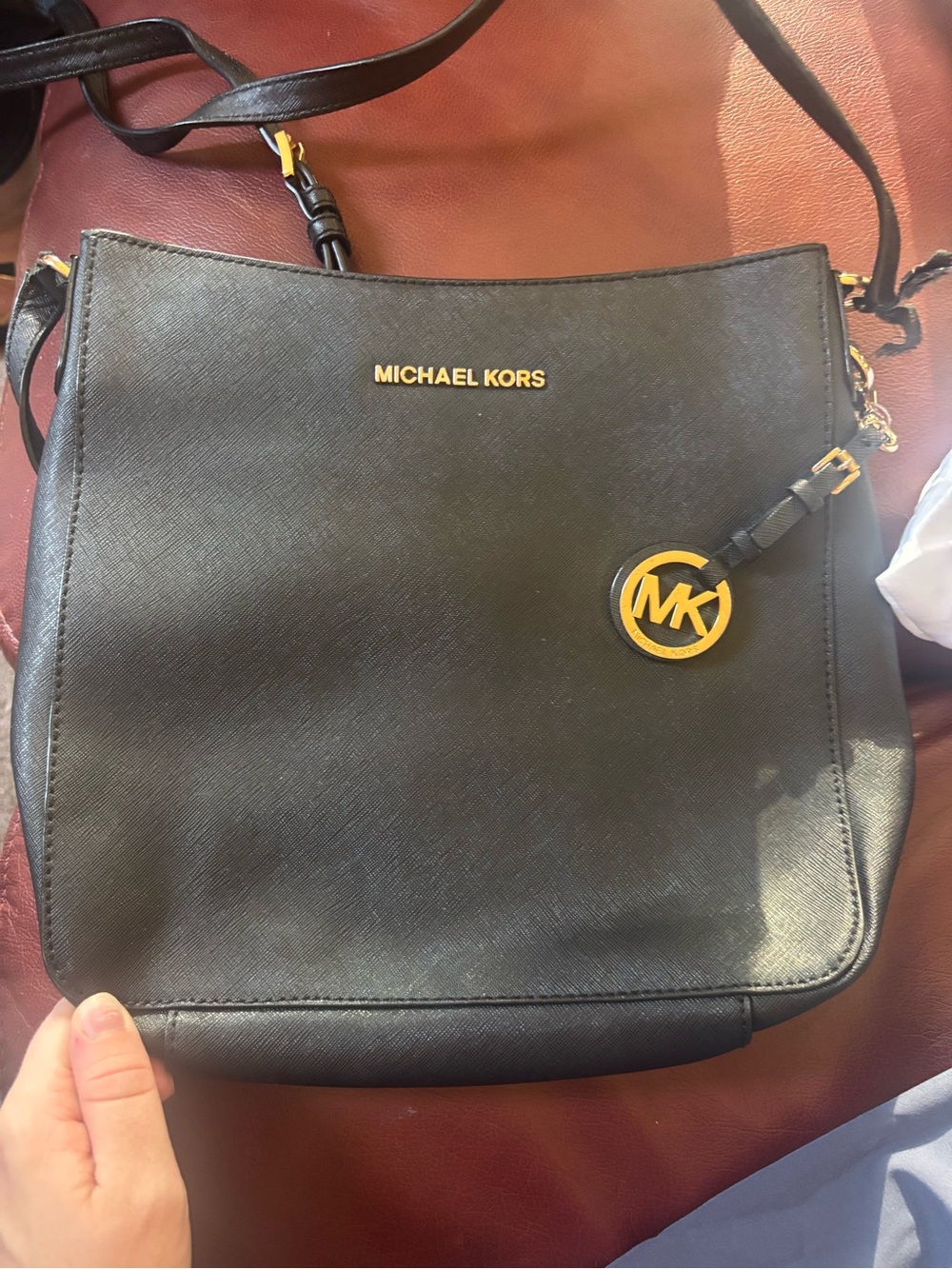 Michael Kors Black Leather Messenger Bag with Gold MK Charm